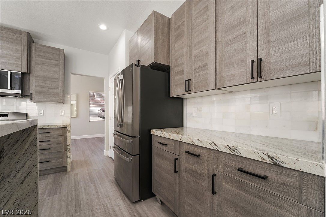 Custom cabinetry and stainless refrigerator